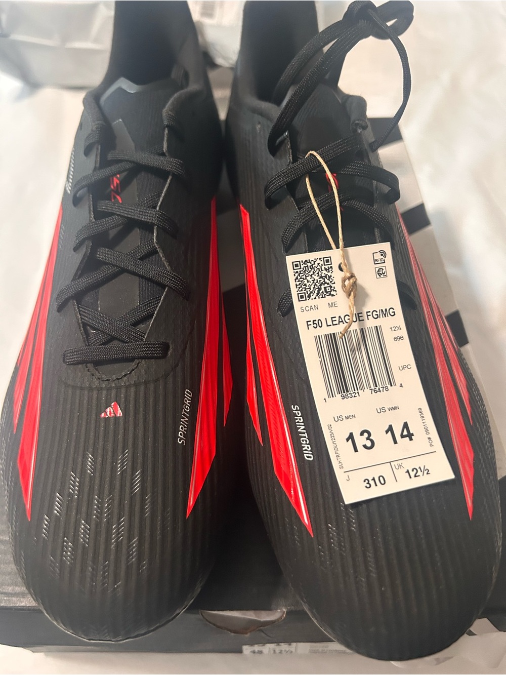 adidas Black Soccer Cleats with Red Accents
